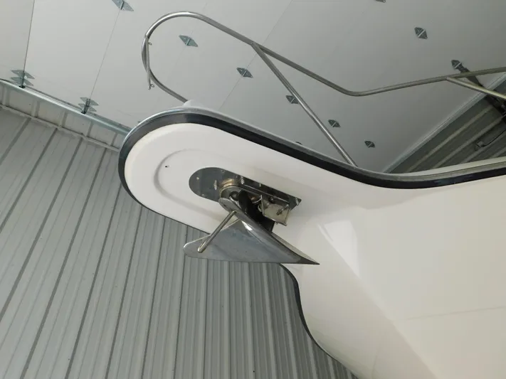 Sun Baked Yacht Photos Pics 1999 Tiara Yachts 3500 Express bow with anchor in storage facility.