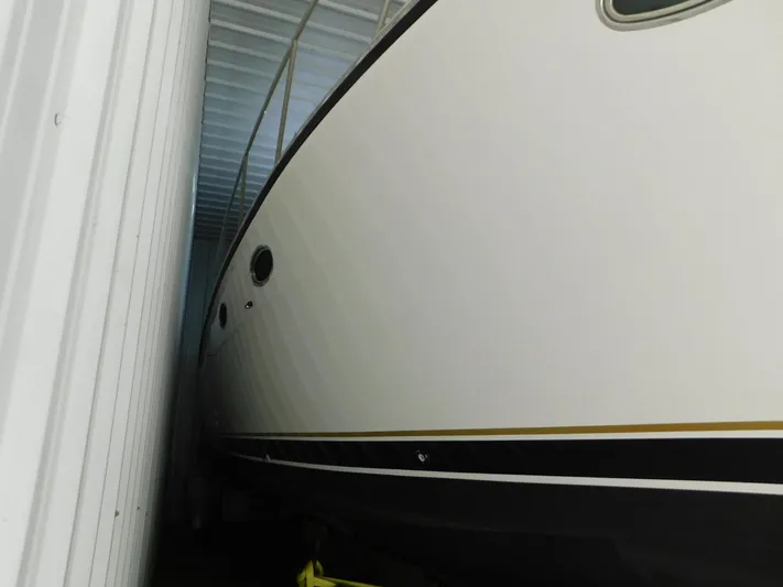 Sun Baked Yacht Photos Pics 1999 Tiara Yachts 3500 Express stored in a covered facility.