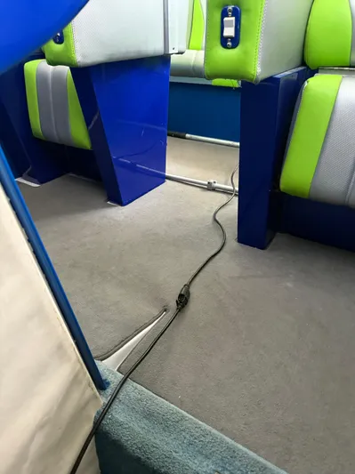  Yacht Photos Pics Interior of a 2008 Outerlimits 39 Quattro boat with blue and green seating.