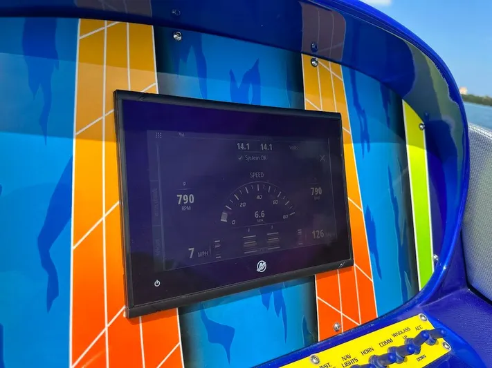  Yacht Photos Pics Dashboard of 2008 Outerlimits 39 Quattro boat with vibrant, colorful design.