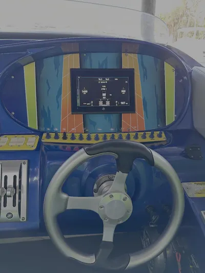  Yacht Photos Pics 2008 Outerlimits 39 Quattro dashboard with colorful design and steering wheel.