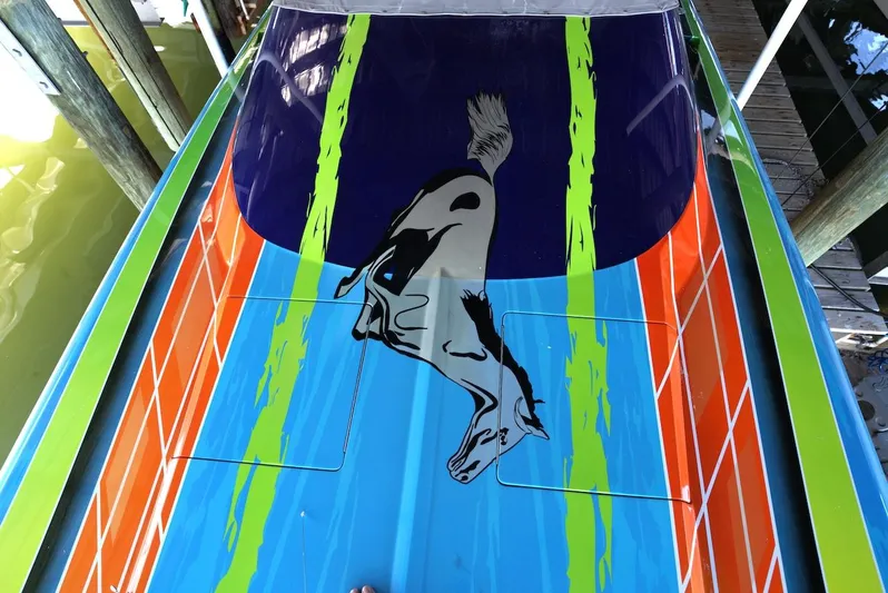  Yacht Photos Pics 2008 Outerlimits 39 Quattro boat with vibrant, colorful design and animal graphic.