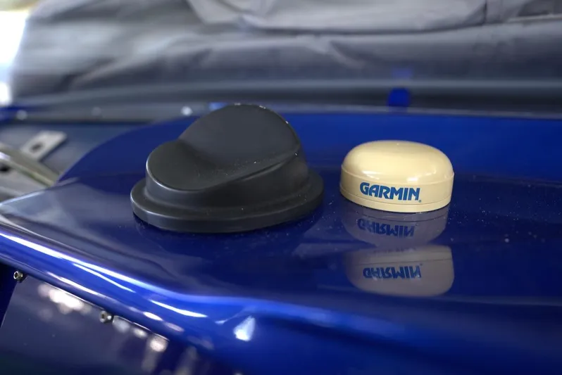  Yacht Photos Pics Two GPS antennas on a blue 2008 Outerlimits 39 Quattro boat.