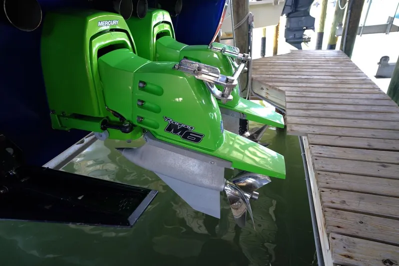  Yacht Photos Pics 2008 Outerlimits 39 Quattro with green Mercury engines at dockside.