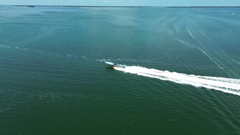  Yacht Photos Pics Aerial view of 2008 Outerlimits 39 Quattro speedboat cruising on open water.