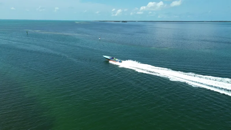  Yacht Photos Pics Aerial view of 2008 Outerlimits 39 Quattro speedboat cruising on open water.