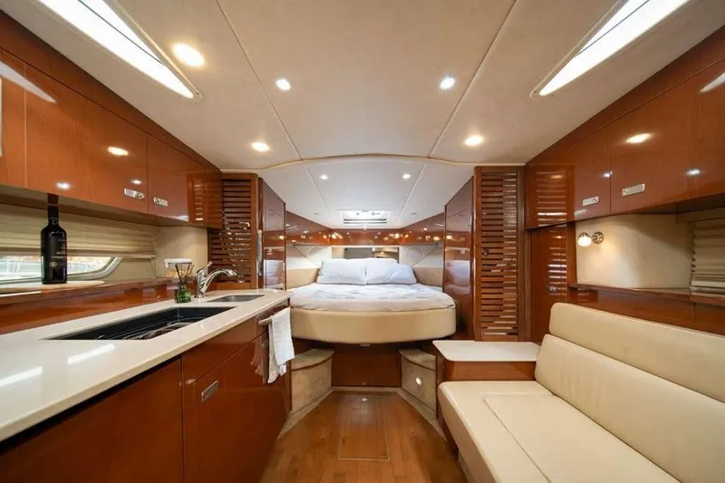  Yacht Photos Pics Luxurious interior of 2010 Sea Ray 370 Sundancer yacht with modern amenities and elegant design.