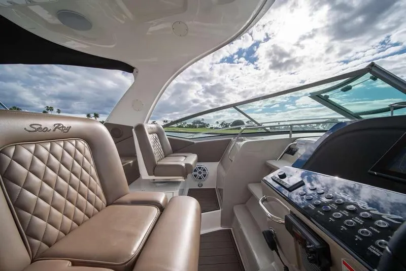  Yacht Photos Pics Luxurious interior of 2010 Sea Ray 370 Sundancer yacht with plush seating and modern controls.