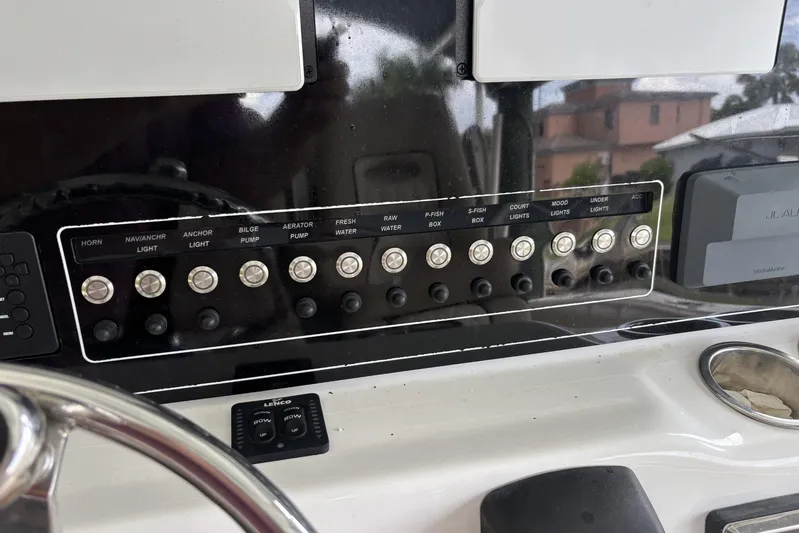  Yacht Photos Pics Control panel of a 2017 Sea Fox 288 Commander boat with labeled switches.