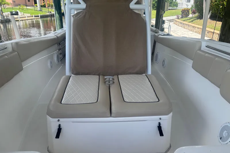  Yacht Photos Pics 2017 Sea Fox 288 Commander boat interior with beige cushioned seating and storage.