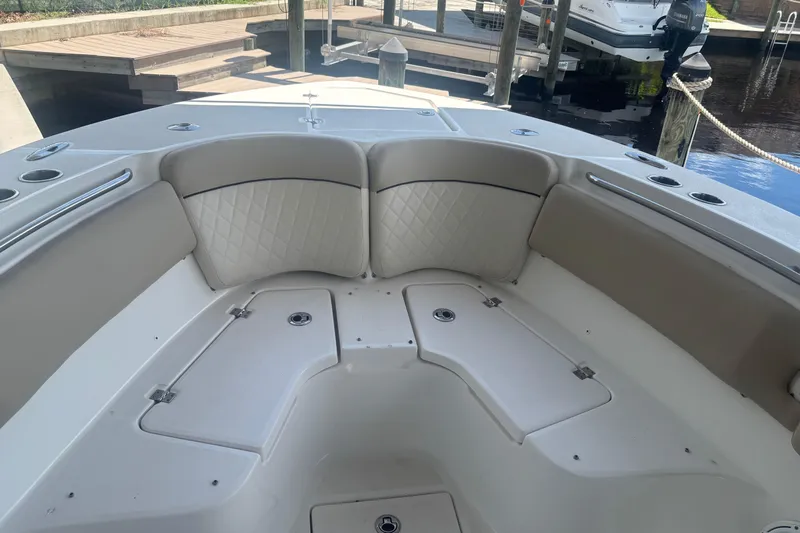  Yacht Photos Pics 2017 Sea Fox 288 Commander boat interior with cushioned seating and storage compartments.