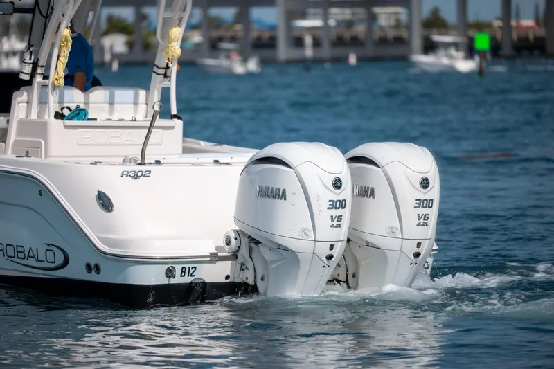  Yacht Photos Pics 2023 Robalo R302 Center Console with twin Yamaha 300 V6 engines on water.