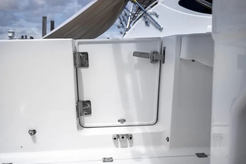 Yacht Photos Pics 2023 Robalo R302 Center Console boat hatch with stainless steel hinges and latch.