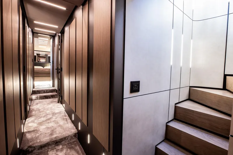  Yacht Photos Pics Luxurious interior of 2025 Pershing GTX 80 yacht with modern hallway and staircase design.