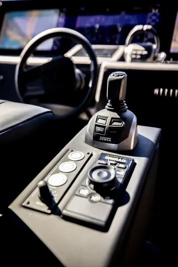  Yacht Photos Pics Control panel of 2025 Pershing GTX 80 yacht with joystick and navigation controls.
