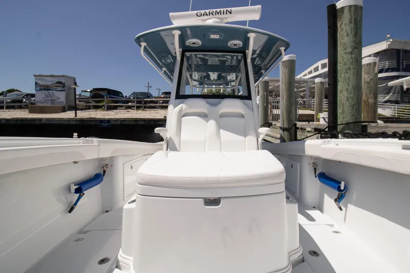  Yacht Photos Pics 2026 Yellowfin 36 Offshore boat docked, showcasing sleek design and spacious seating.