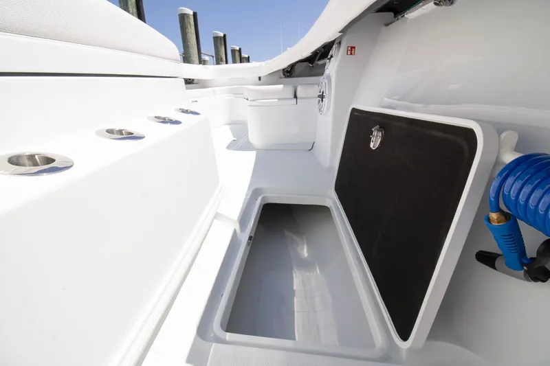  Yacht Photos Pics 2026 Yellowfin 36 Offshore boat interior with storage compartment and rod holders.