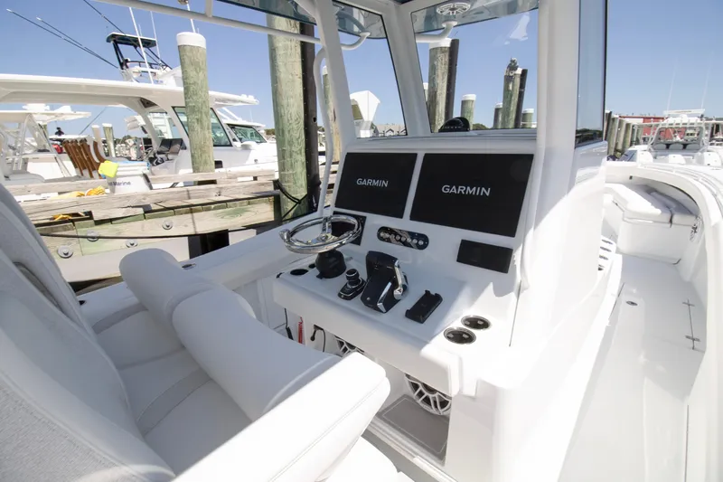  Yacht Photos Pics 2026 Yellowfin 36 Offshore boat cockpit with Garmin navigation displays at marina.