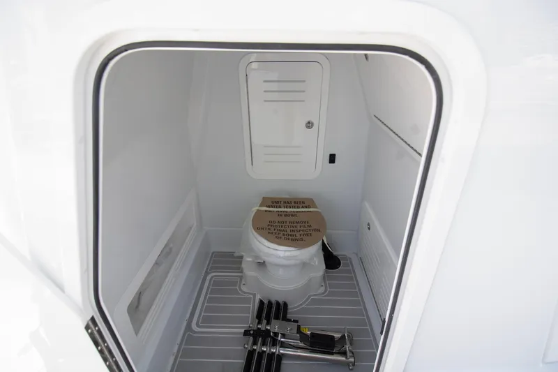  Yacht Photos Pics 2026 Yellowfin 36 Offshore boat interior with compact bathroom and storage space.