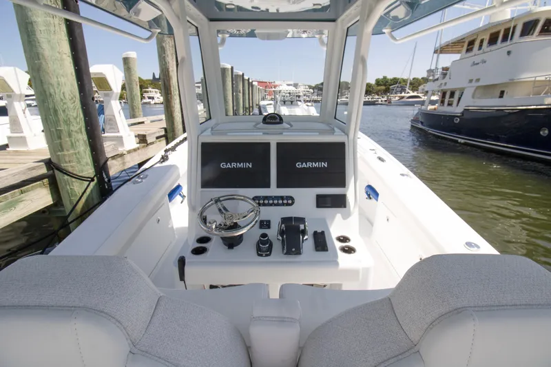  Yacht Photos Pics 2026 Yellowfin 36 Offshore boat cockpit with Garmin navigation system at marina.