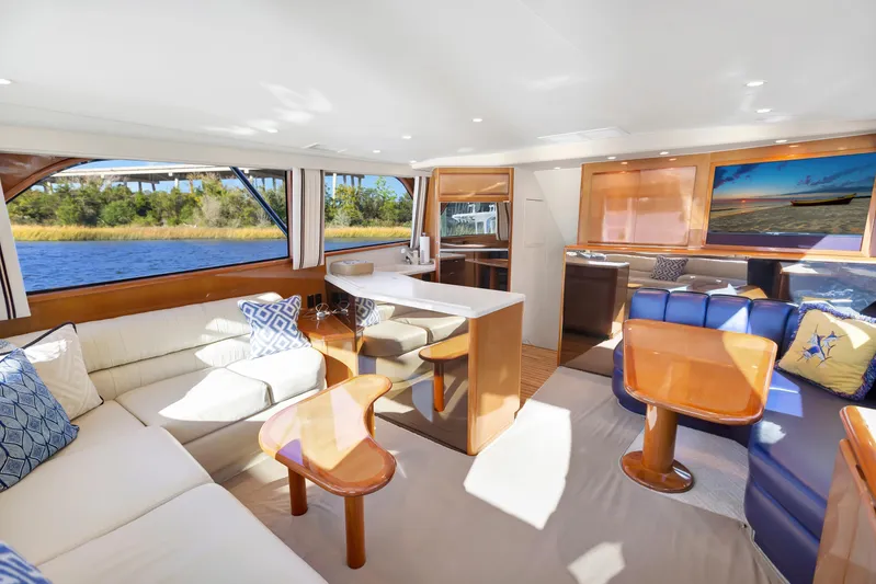 Lady S Yacht Photos Pics Luxurious interior of 2001 Viking 50 Convertible yacht with elegant seating and scenic views.