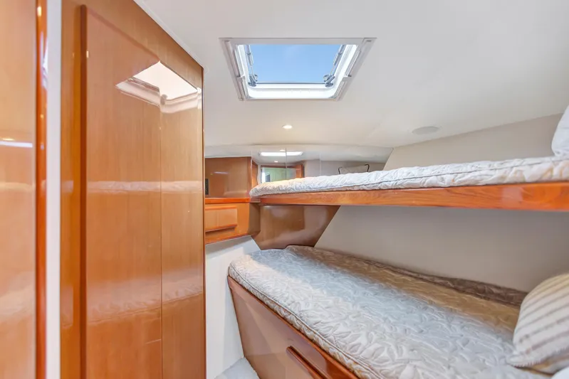 Lady S Yacht Photos Pics 2001 Viking 50 Convertible yacht interior with wooden bunk beds and skylight.