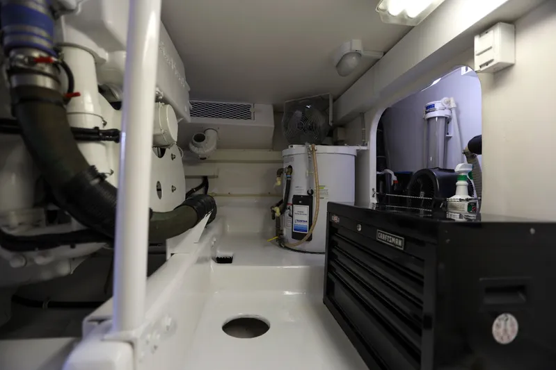 Lady S Yacht Photos Pics Engine room of 2001 Viking 50 Convertible yacht with tools and equipment.