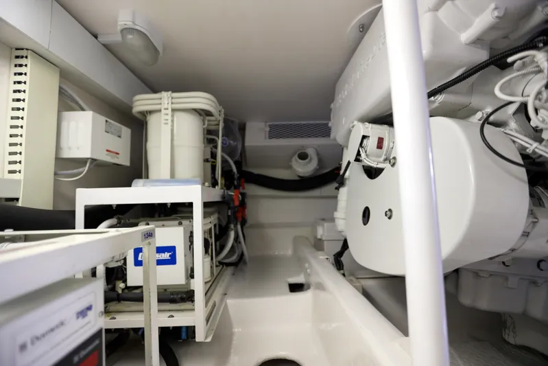 Lady S Yacht Photos Pics Engine room of 2001 Viking 50 Convertible yacht, showcasing mechanical components and systems.