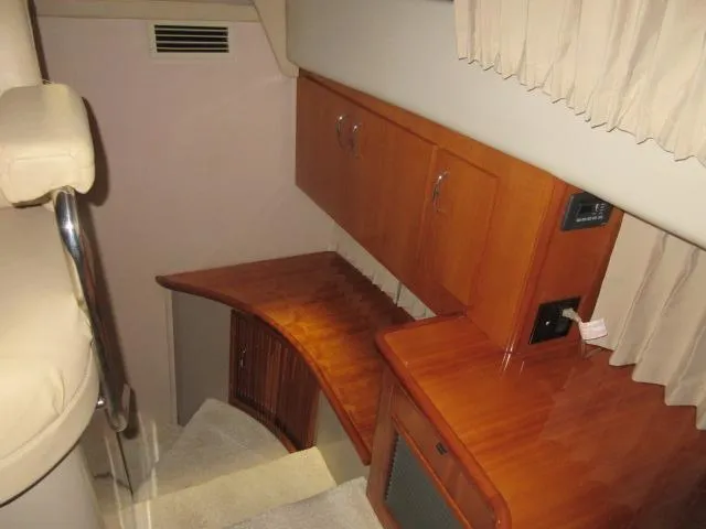  Yacht Photos Pics Interior of 2005 Carver 36 Sport Sedan, featuring wooden cabinetry and stairs.