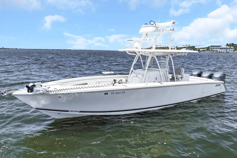  Yacht Photos Pics 2017 Jupiter 34 FS boat on water, featuring triple outboard engines.