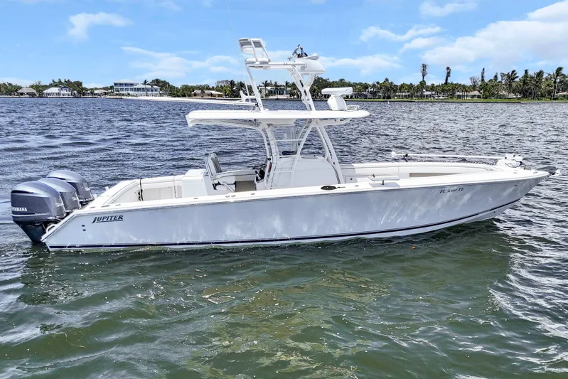  Yacht Photos Pics 2017 Jupiter 34 FS boat on water with twin Yamaha engines, clear sky background.