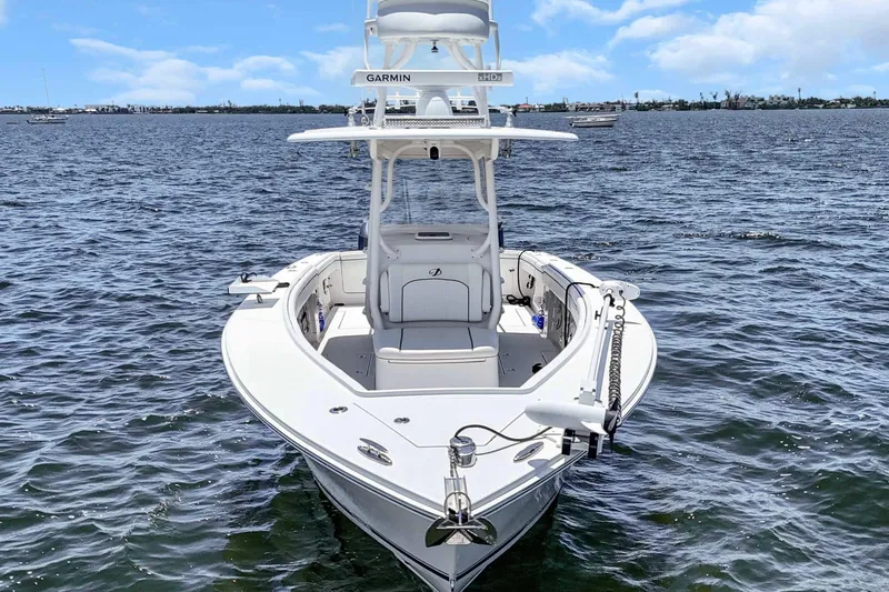  Yacht Photos Pics 2017 Jupiter 34 FS boat on water, front view, clear sky background.