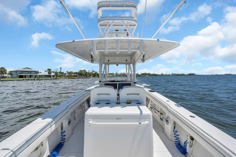  Yacht Photos Pics 2017 Jupiter 34 FS boat on water, clear sky, coastal view.