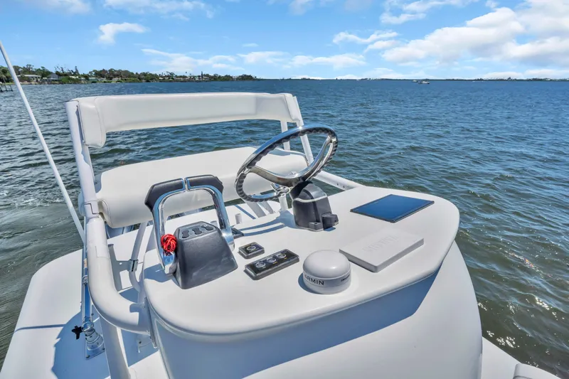  Yacht Photos Pics 2017 Jupiter 34 FS boat helm with steering wheel and controls on open water.
