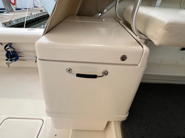  Yacht Photos Pics 1998 Pursuit 3400 Offshore DIESEL boat interior with storage compartment and seating.