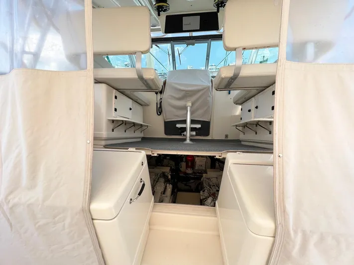  Yacht Photos Pics 1998 Pursuit 3400 Offshore DIESEL boat interior with seating and storage compartments.
