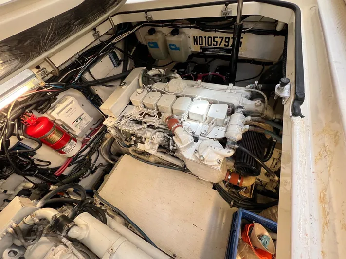  Yacht Photos Pics Engine compartment of a 1998 Pursuit 3400 Offshore DIESEL boat, showcasing mechanical components.