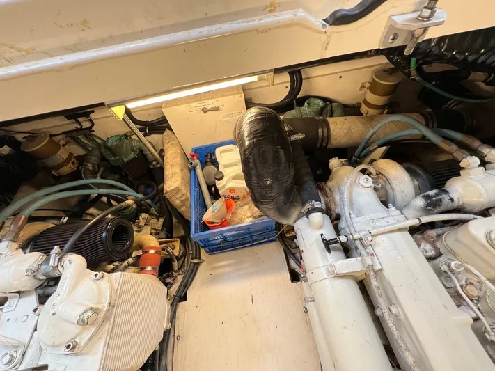  Yacht Photos Pics Engine room of a 1998 Pursuit 3400 Offshore DIESEL boat, showing mechanical components.