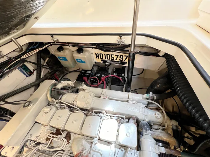  Yacht Photos Pics Engine compartment of a 1998 Pursuit 3400 Offshore DIESEL boat, showing detailed components and wiring.