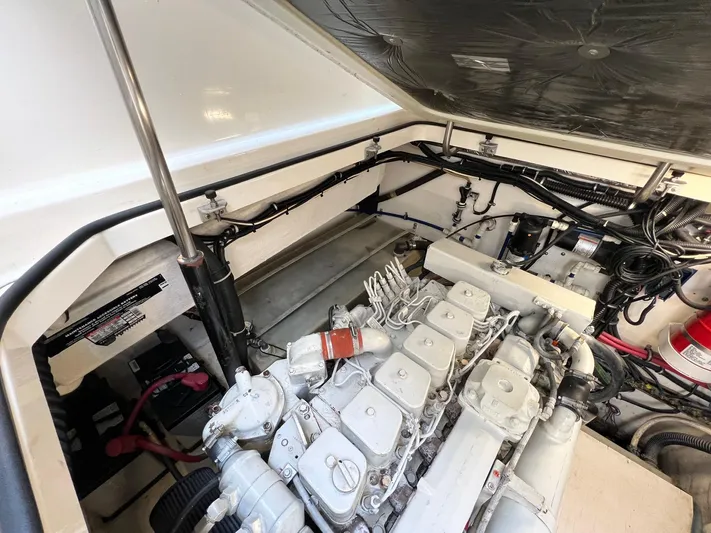  Yacht Photos Pics 1998 Pursuit 3400 Offshore DIESEL engine compartment, showcasing detailed mechanical components.