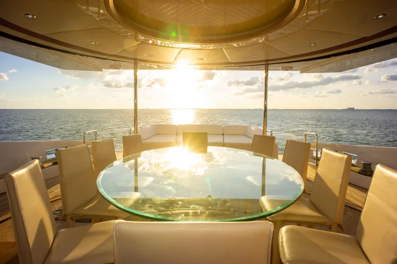  Yacht Photos Pics Luxurious Azimut 98 Leonardo yacht dining area with ocean sunset view, 2006 model.