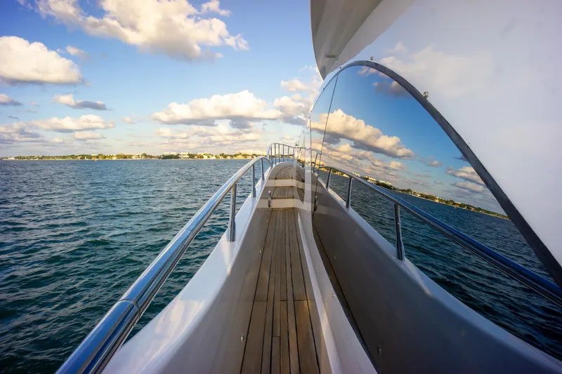 Yacht Photos Pics Side view of 2006 Azimut 98 Leonardo yacht on open water under a blue sky.