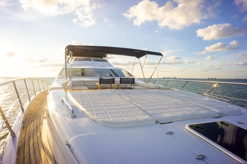  Yacht Photos Pics Luxurious 2006 Azimut 98 Leonardo yacht deck with sunbathing area, ocean view, and clear sky.