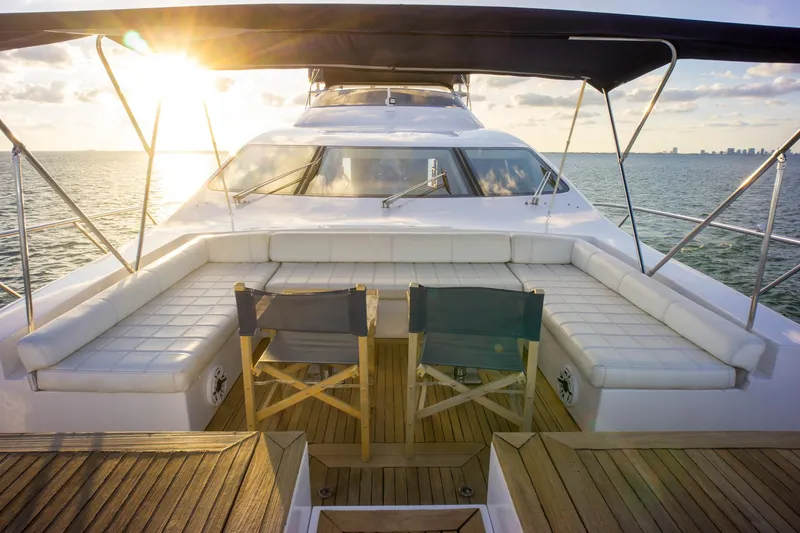  Yacht Photos Pics Luxurious 2006 Azimut 98 Leonardo yacht deck with seating, ocean view, and sunset.