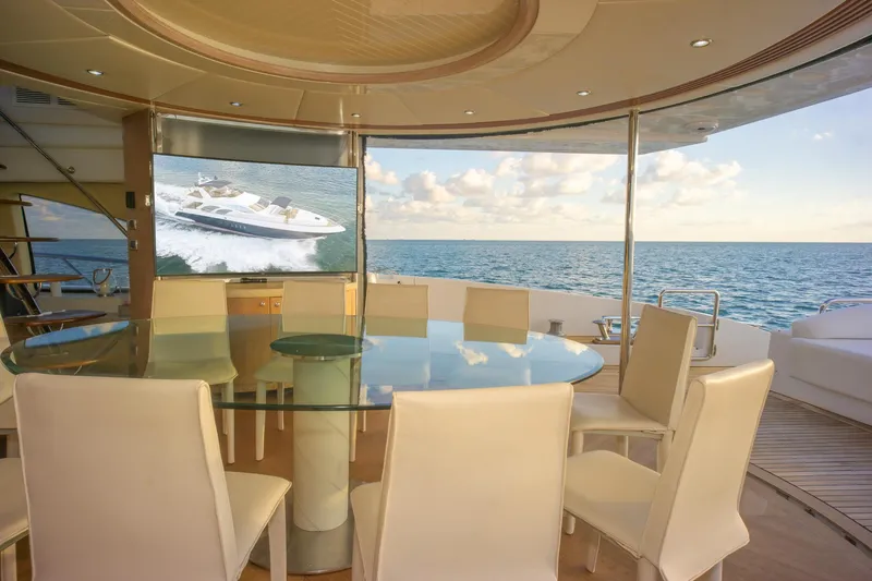  Yacht Photos Pics Luxurious interior of 2006 Azimut 98 Leonardo yacht with ocean view and elegant dining area.