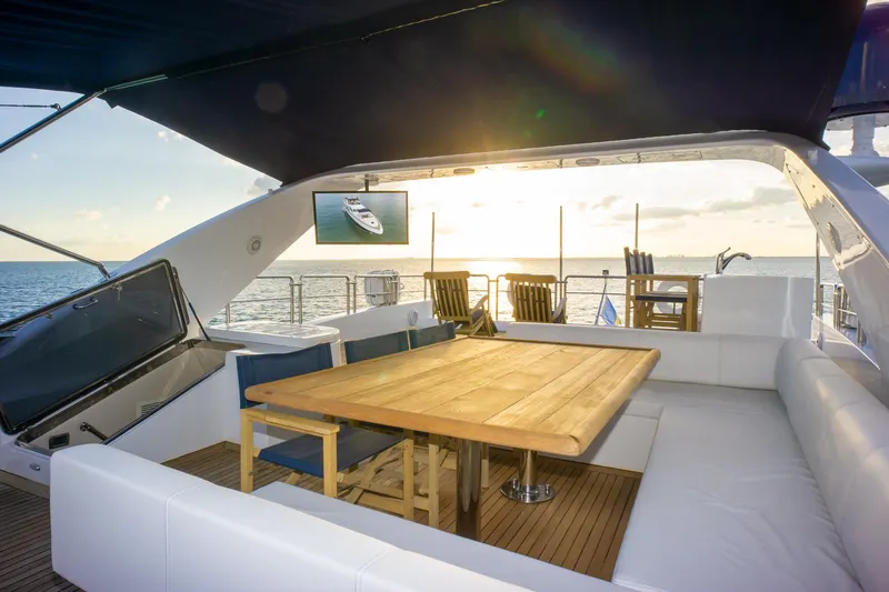  Yacht Photos Pics Luxurious 2006 Azimut 98 Leonardo yacht deck with sunset view and elegant seating area.