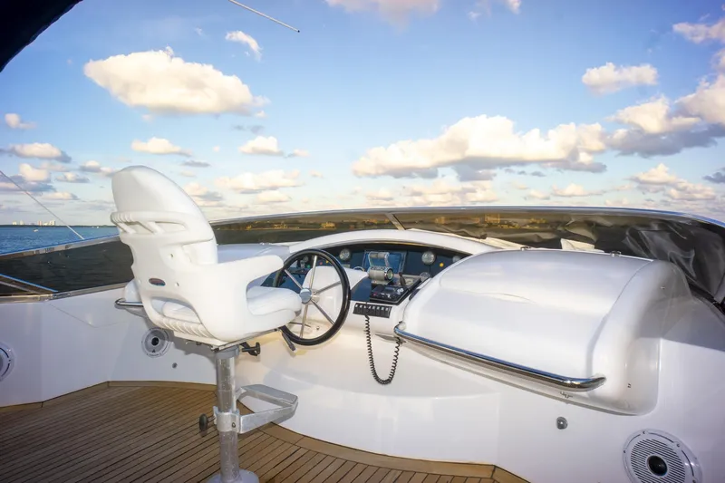 Yacht Photos Pics Helm of 2006 Azimut 98 Leonardo yacht with steering wheel and captain's chair.