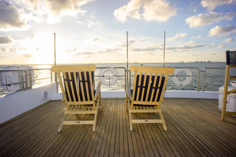  Yacht Photos Pics Deck chairs on Azimut 98 Leonardo yacht, 2006, overlooking ocean at sunset.