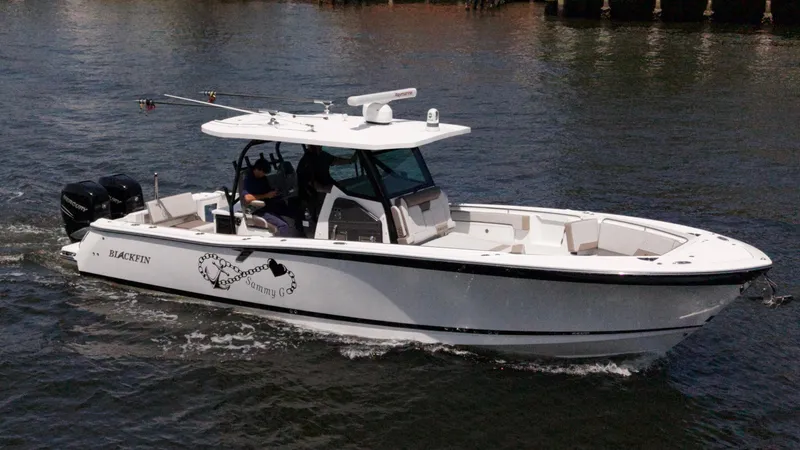 Sammy G Yacht Photos Pics 2020 Blackfin 332 CC boat cruising on water, featuring sleek design and twin engines.
