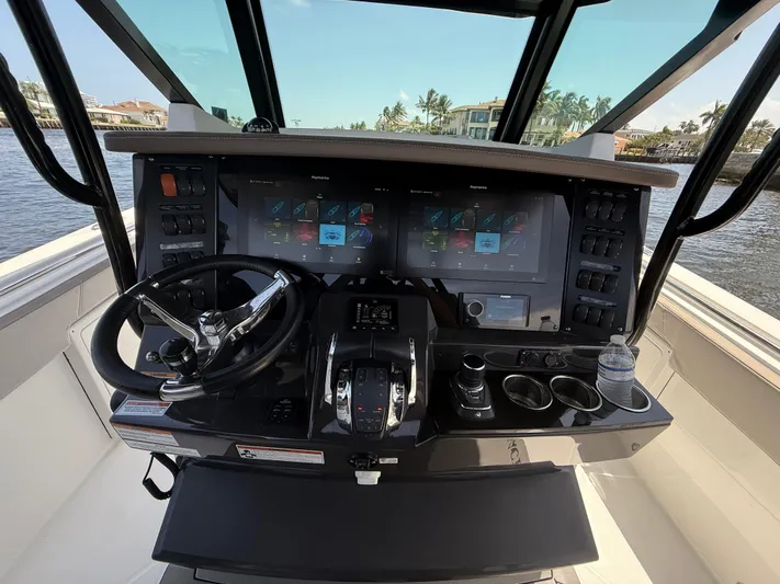 Sammy G Yacht Photos Pics 2020 Blackfin 332 CC helm with advanced navigation displays and controls.